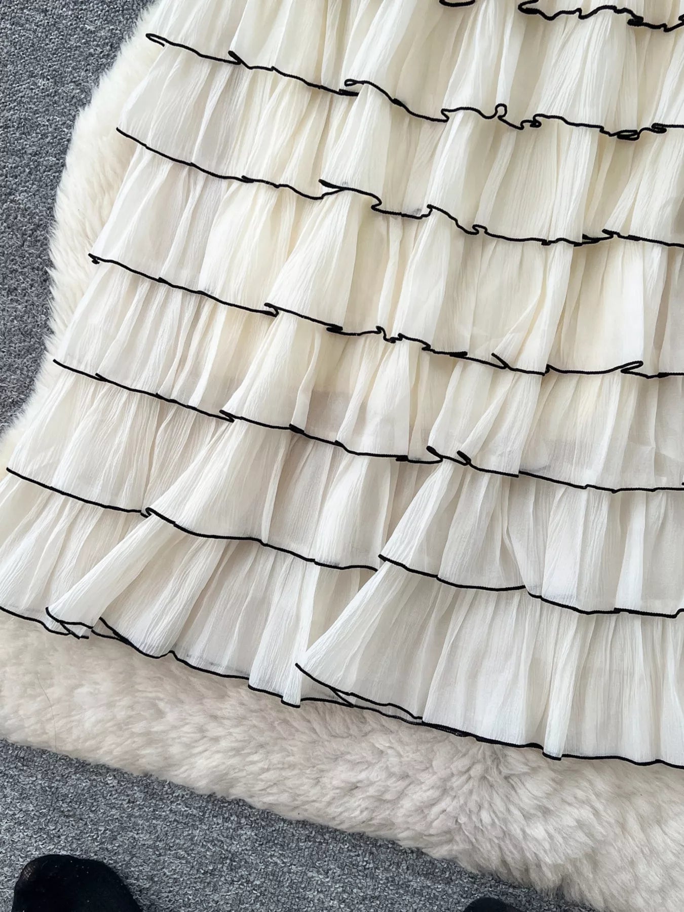 Ruffled tiered skirt back view in apricot
