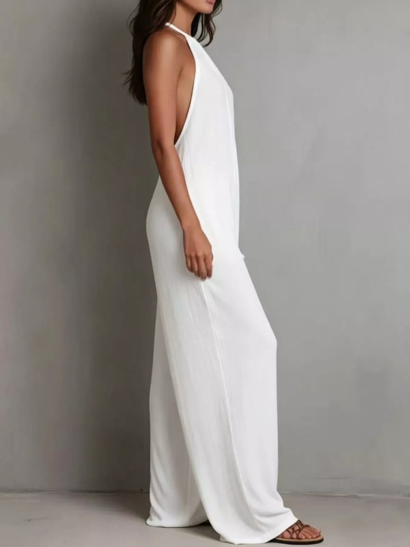 Wide leg jumpsuit side view showing flowing legs