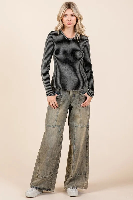 Model wearing washed wide leg jeans styled look