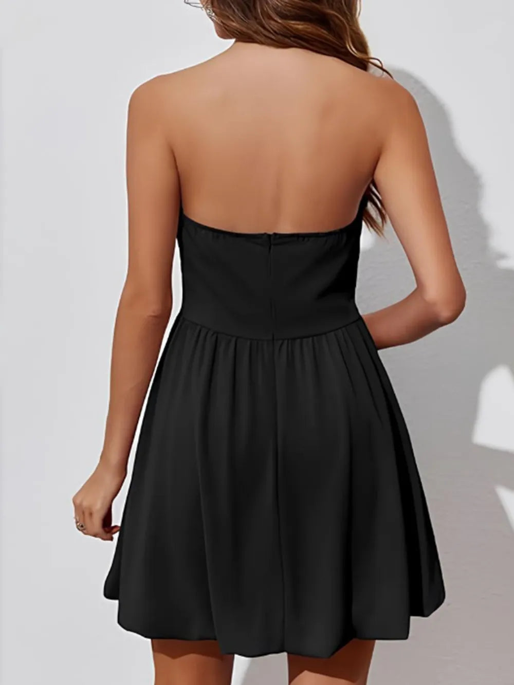 Black tube mini dress back view showing ruching
