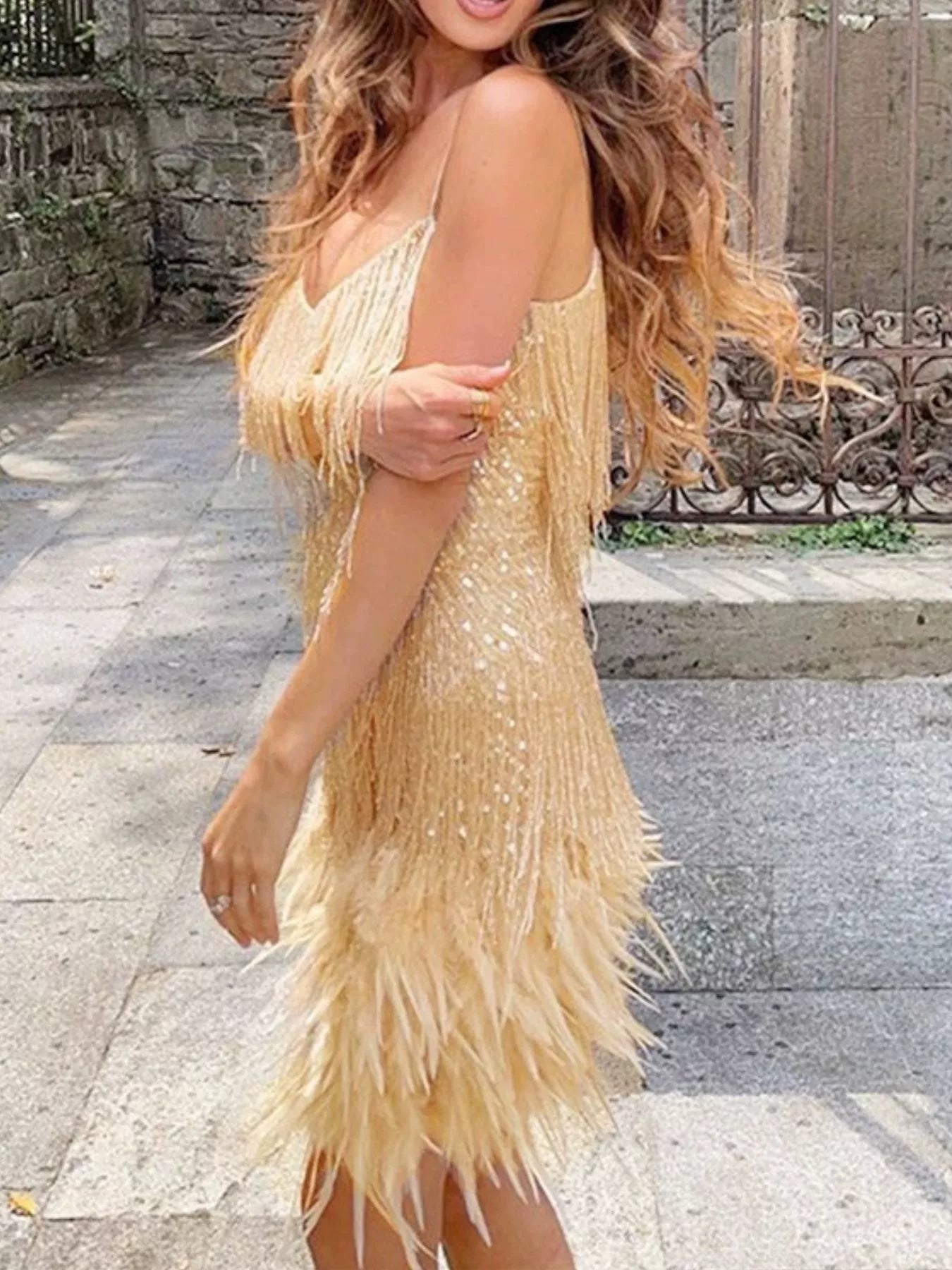Close up of sequin fabric on fringe party dress