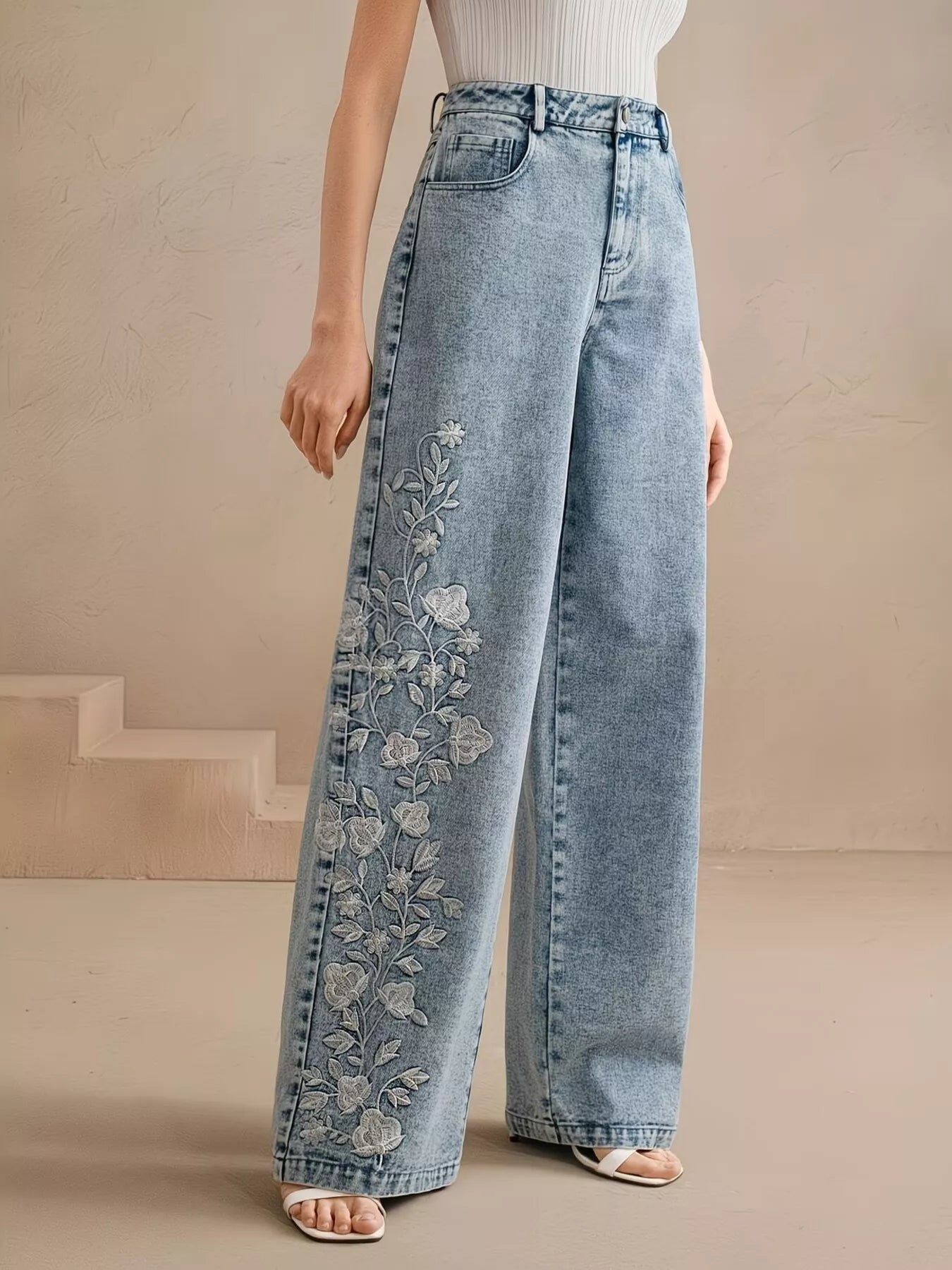 Embroidered wide leg jeans in blue front view