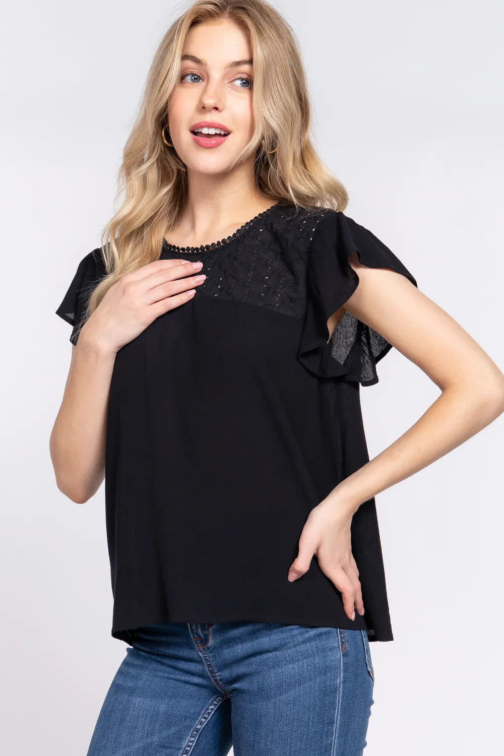 Crochet detail on ruffle short sleeve blouse