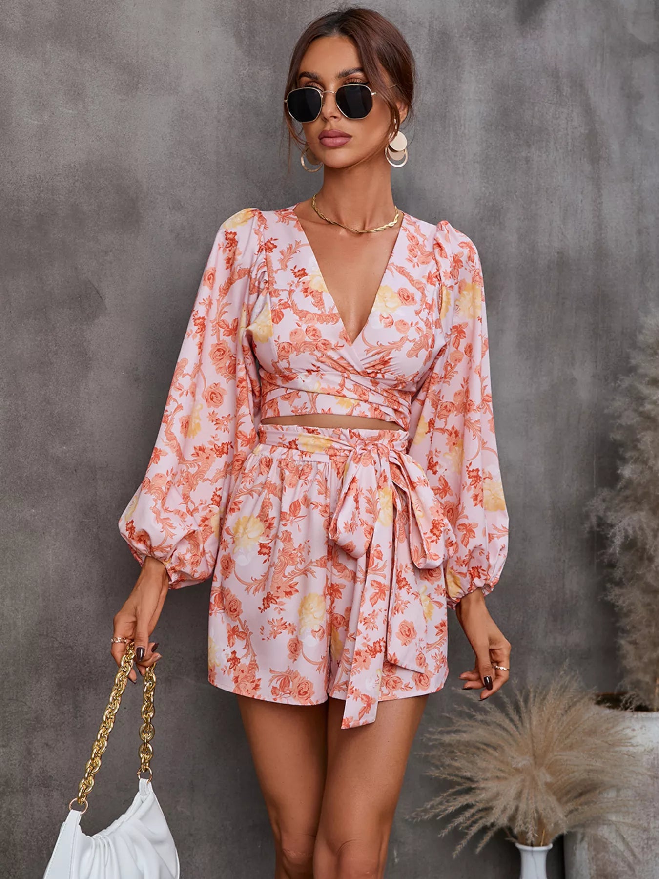 Printed long sleeve romper full look on model