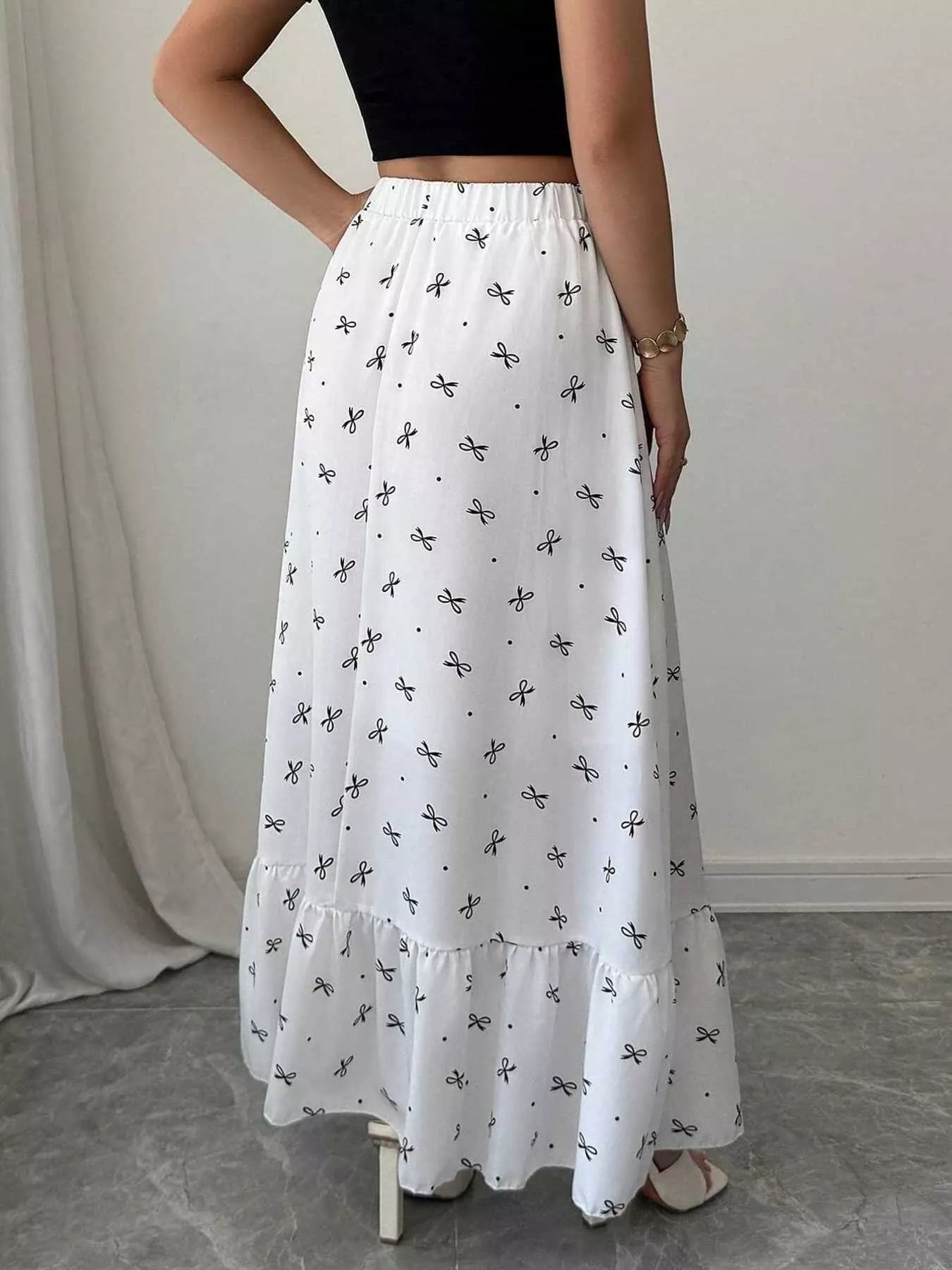 White bow print maxi skirt on model