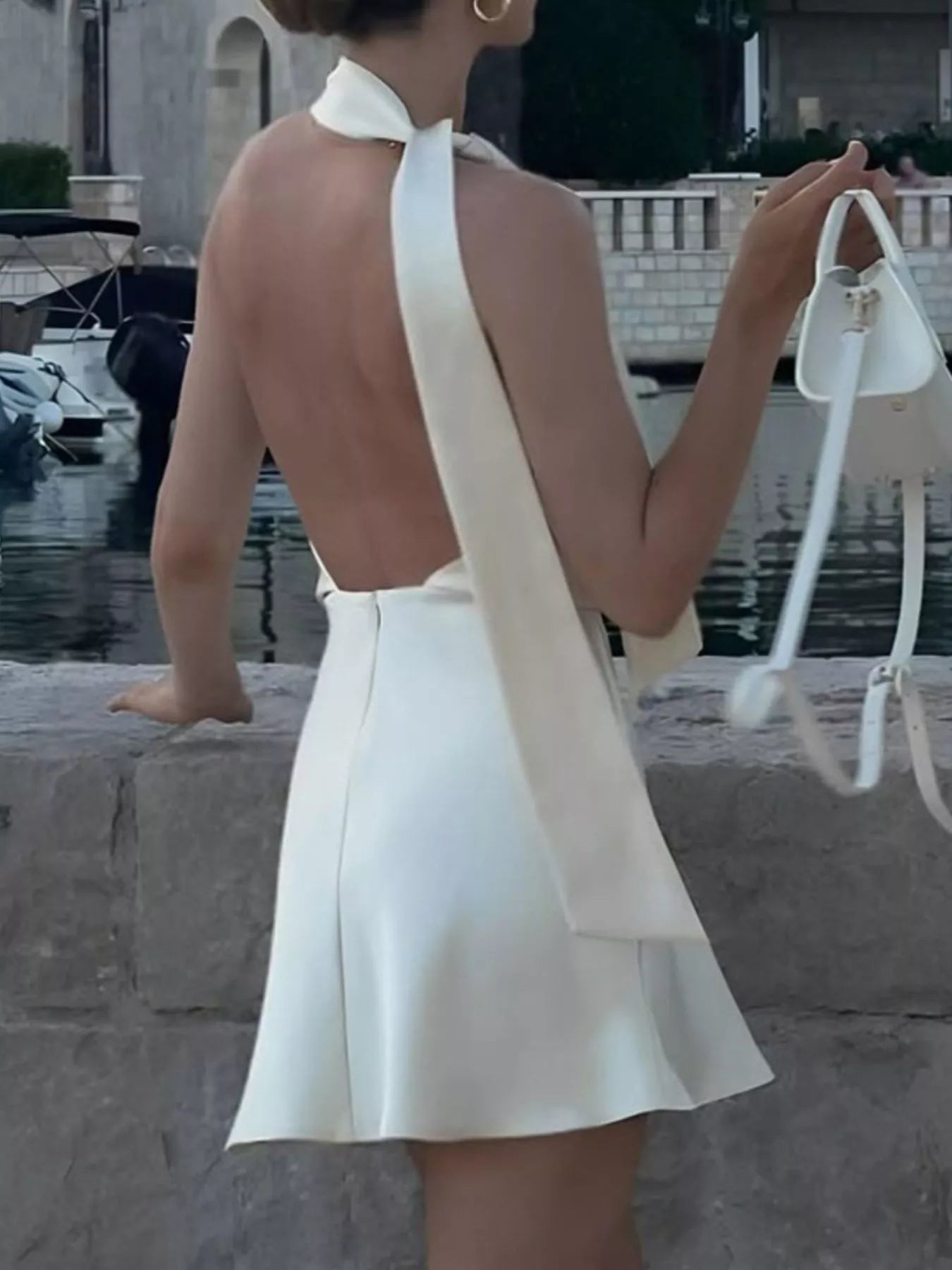 Backless mini dress back view showing open detail