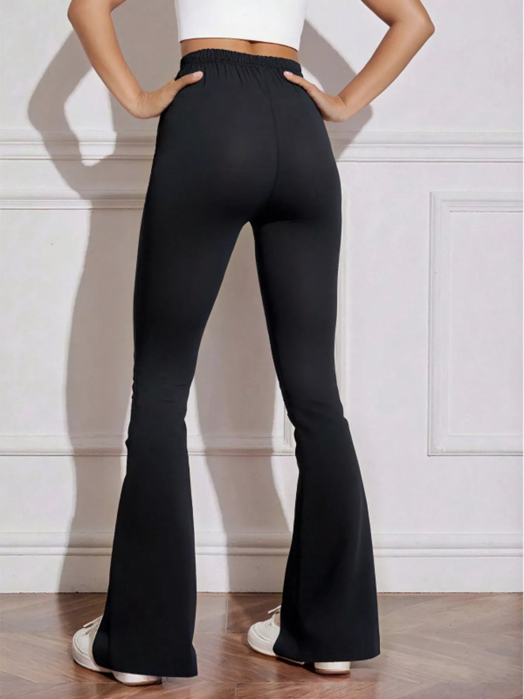 Black drawstring active pants styled with sneakers