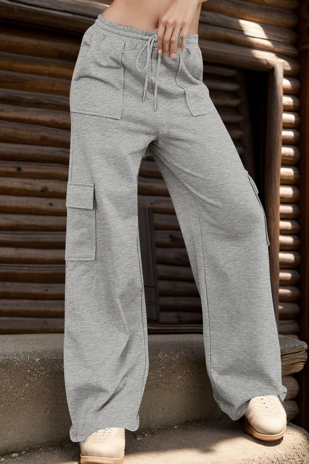 Gray drawstring active pants with pockets front view
