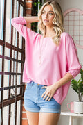 Pink textured smocked half sleeve top front view