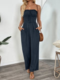Dark blue smocked tube wide leg jumpsuit front view