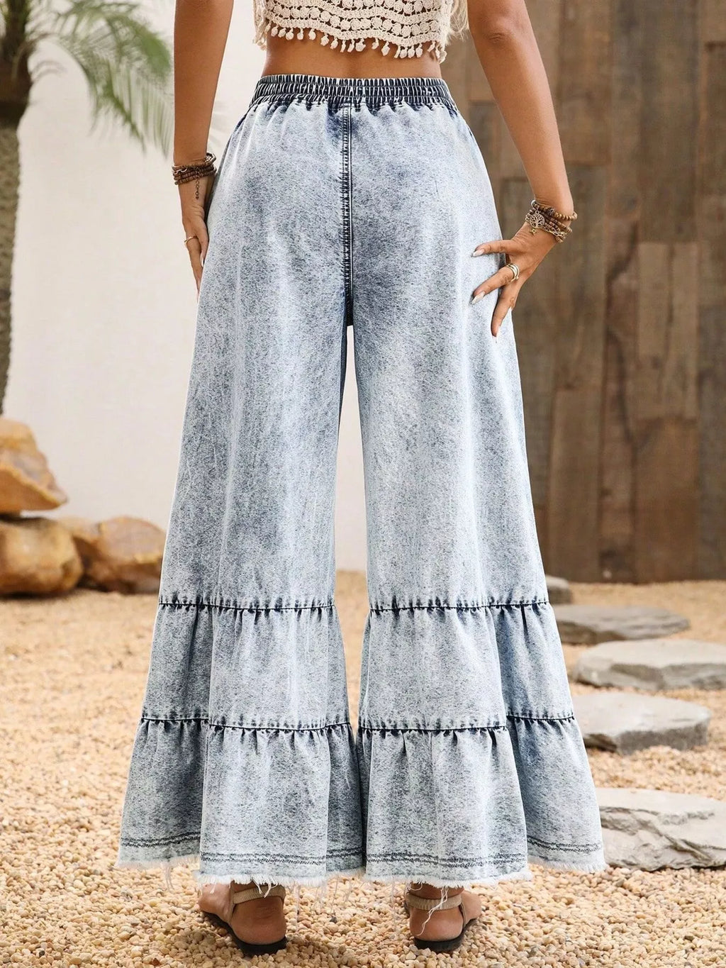 Side view of white raw hem flare jeans