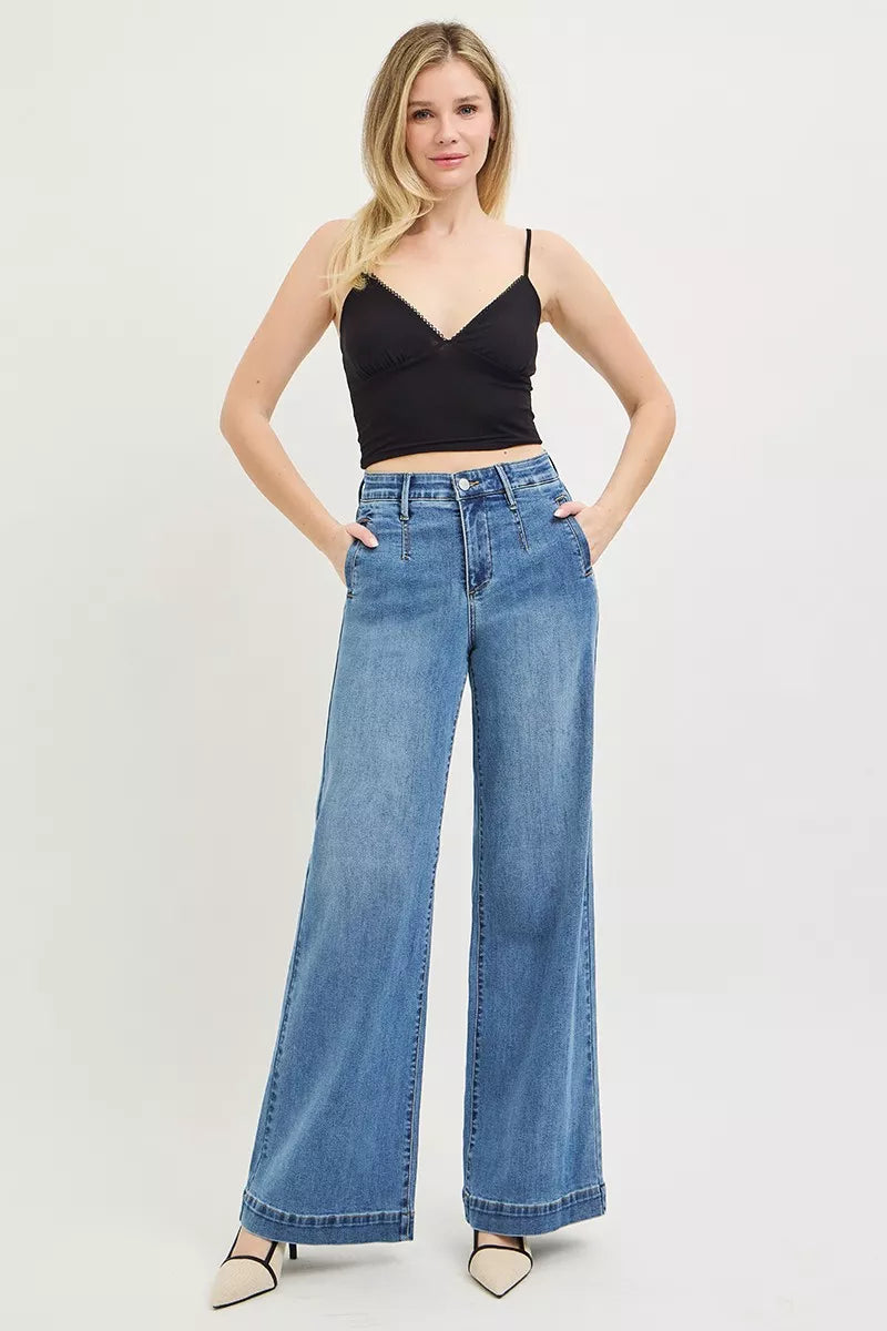 Medium wash denim detail on RISEN jeans