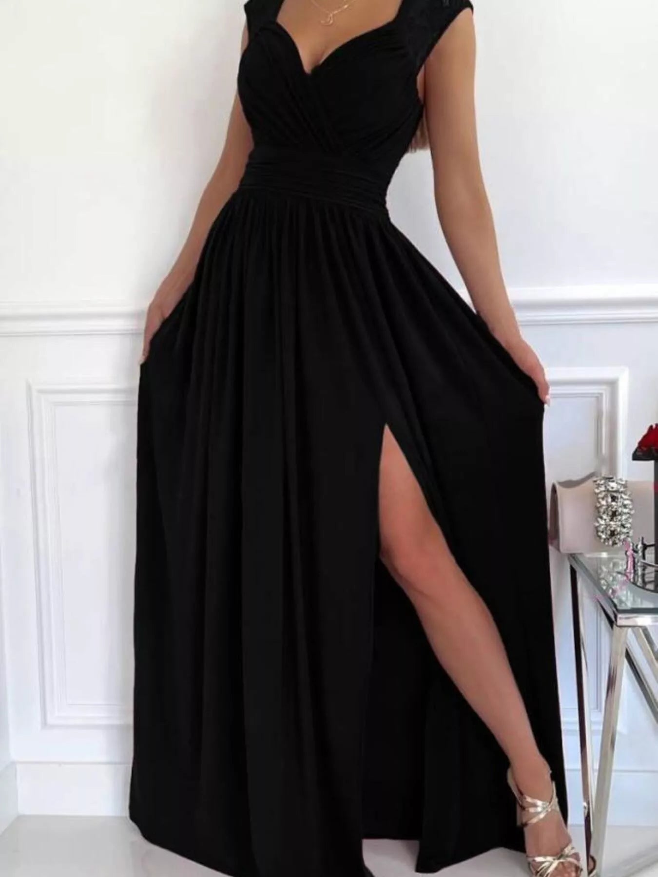 High slit lace maxi dress seated pose