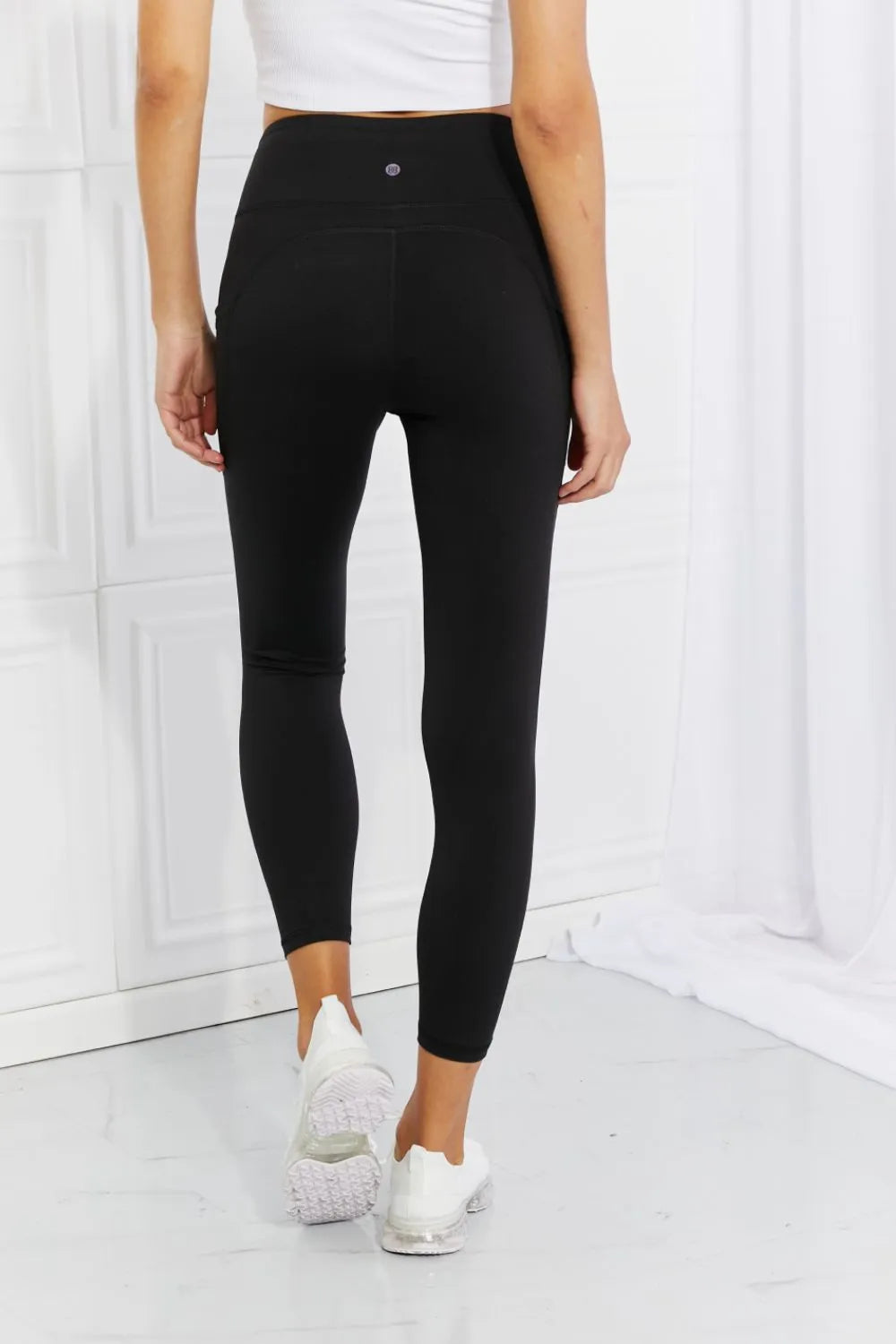 Reflective dot detail on black leggings