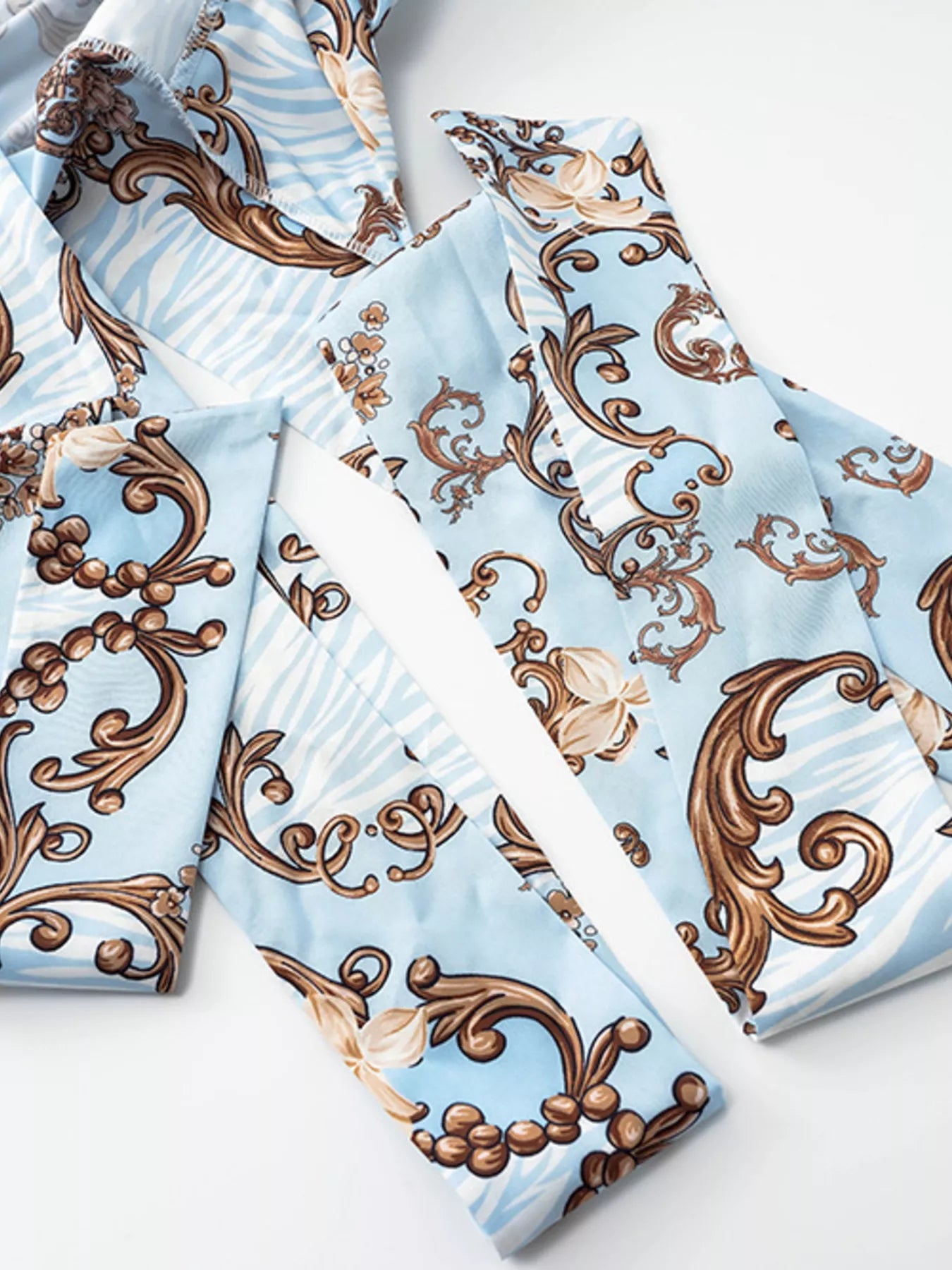 Printed long sleeve romper back detail