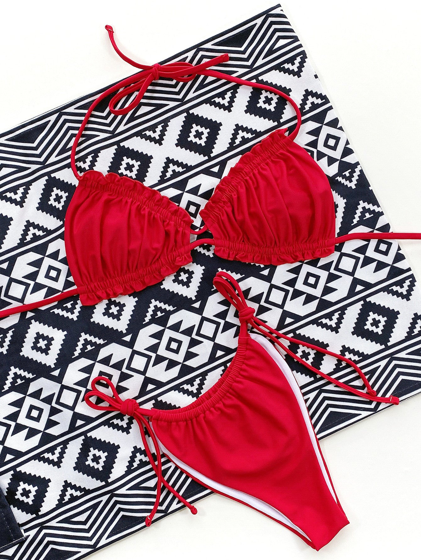 Red halter neck bikini set on model