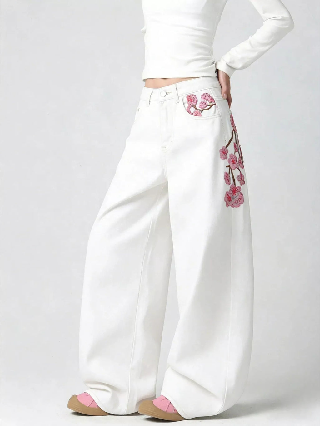 Embroidered wide leg jeans in black front view