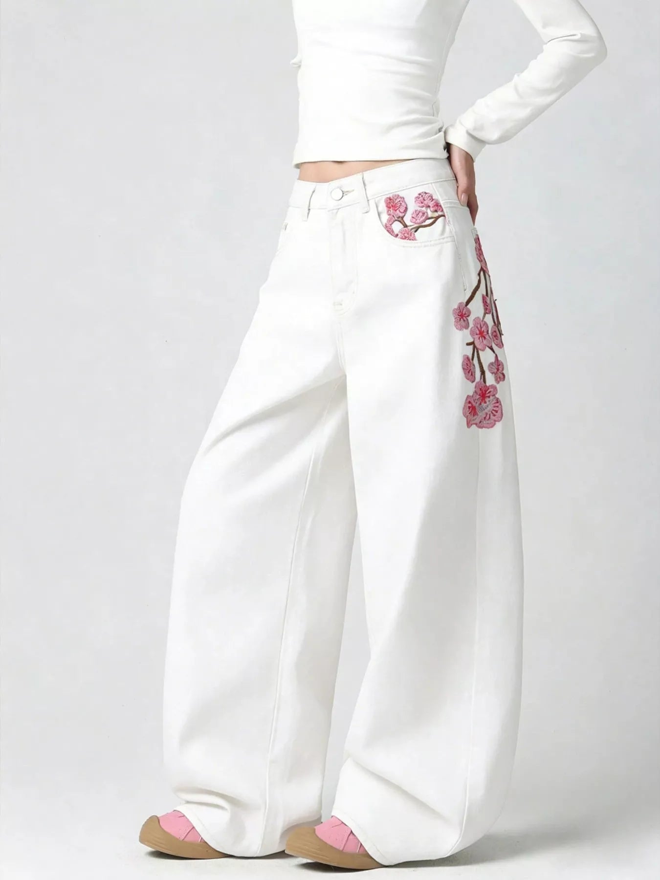 Embroidered wide leg jeans in black front view