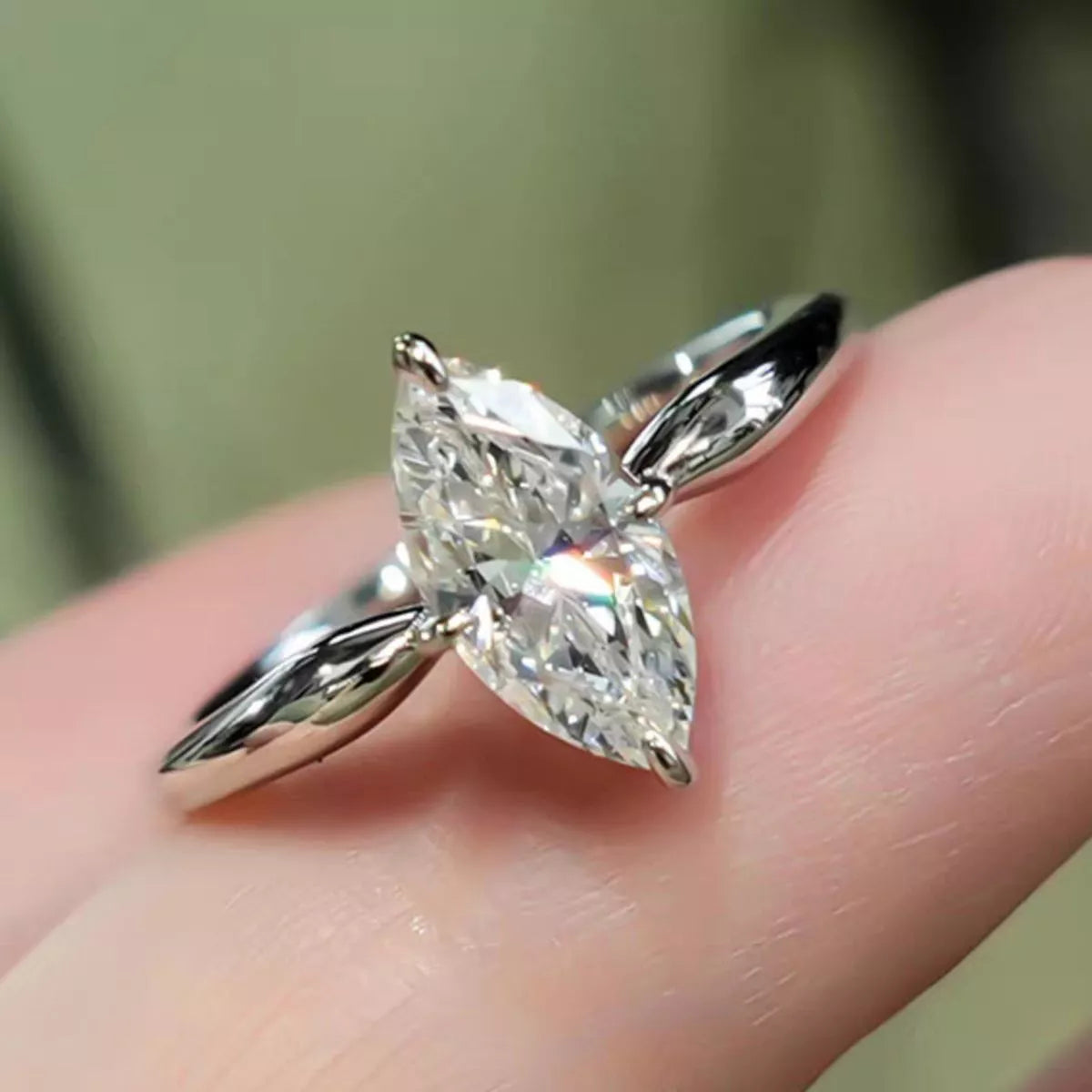 2 carat moissanite ring shown on a hand