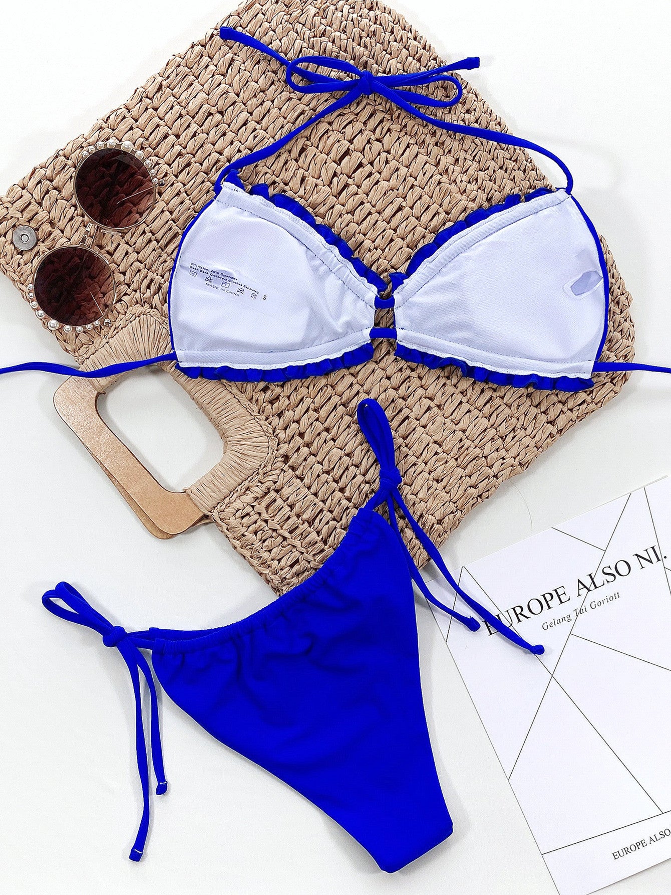 Black halter neck bikini set on model