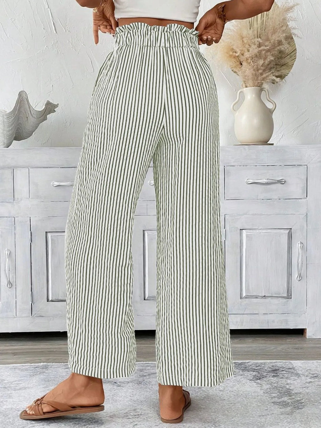Army green paper bag pants side view on model