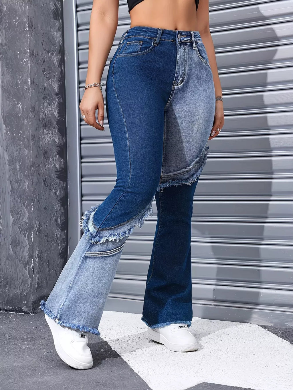 Blue two tone frayed hem flare jeans front view on model