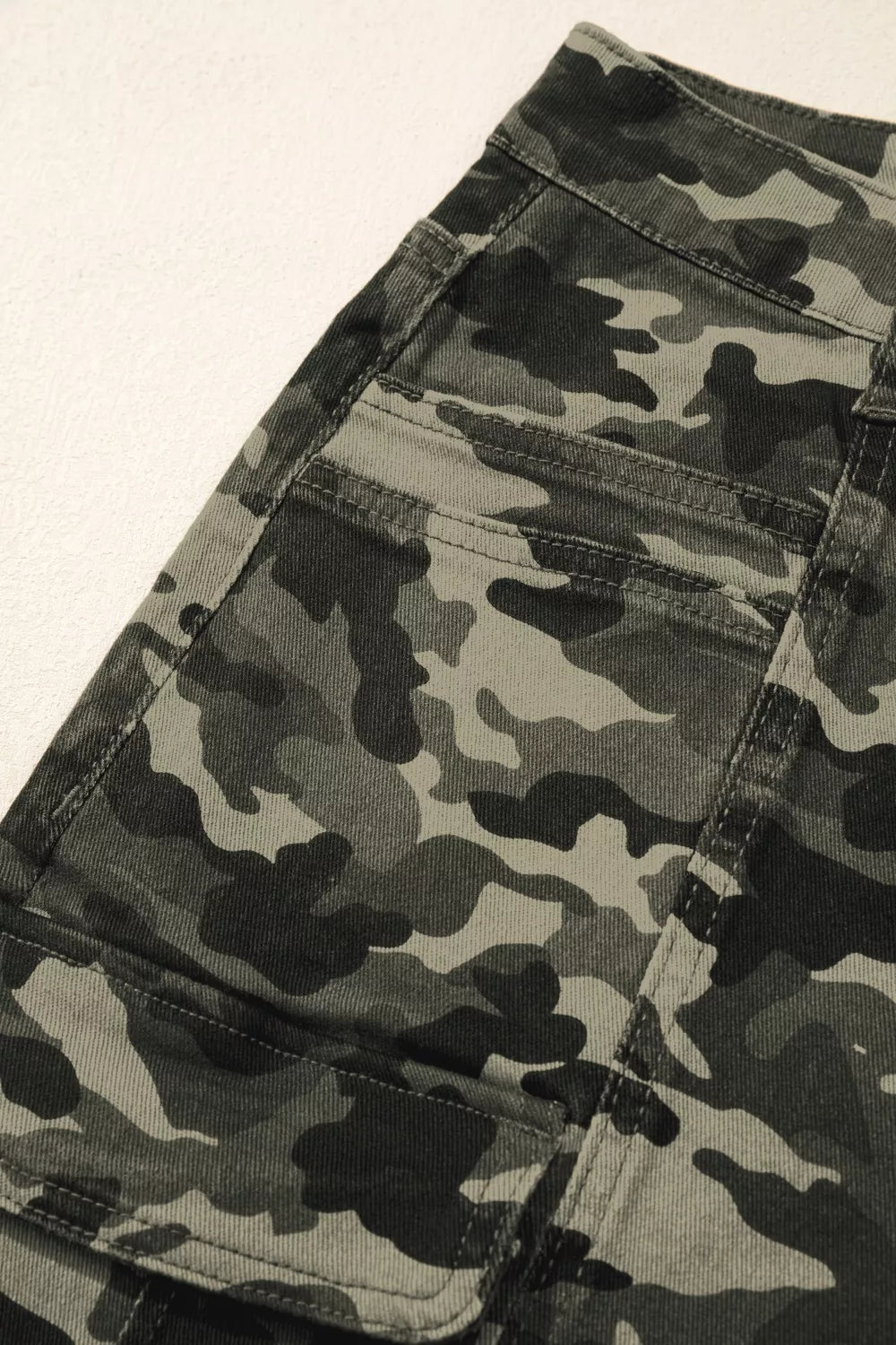 Back pocket detail on camouflage denim pants