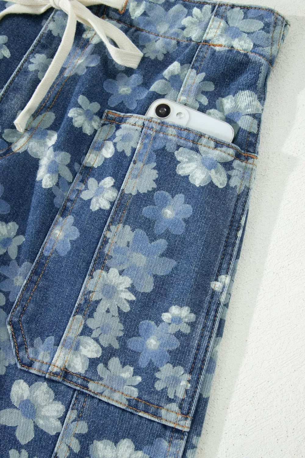 Ankle length cut of floral barrel jeans