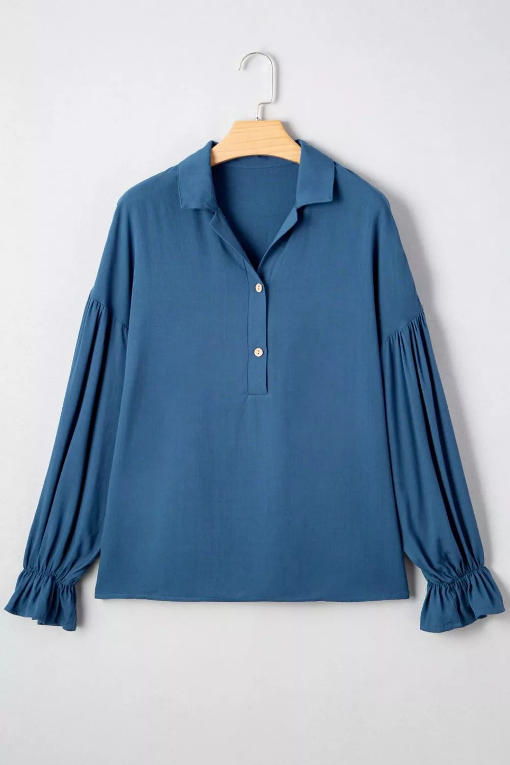 Model wearing peacock blue flounce sleeve blouse