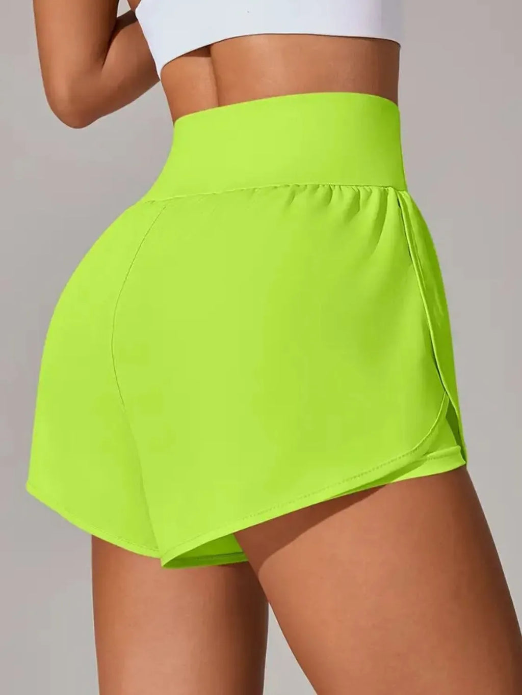 Blush pink workout shorts back view on model