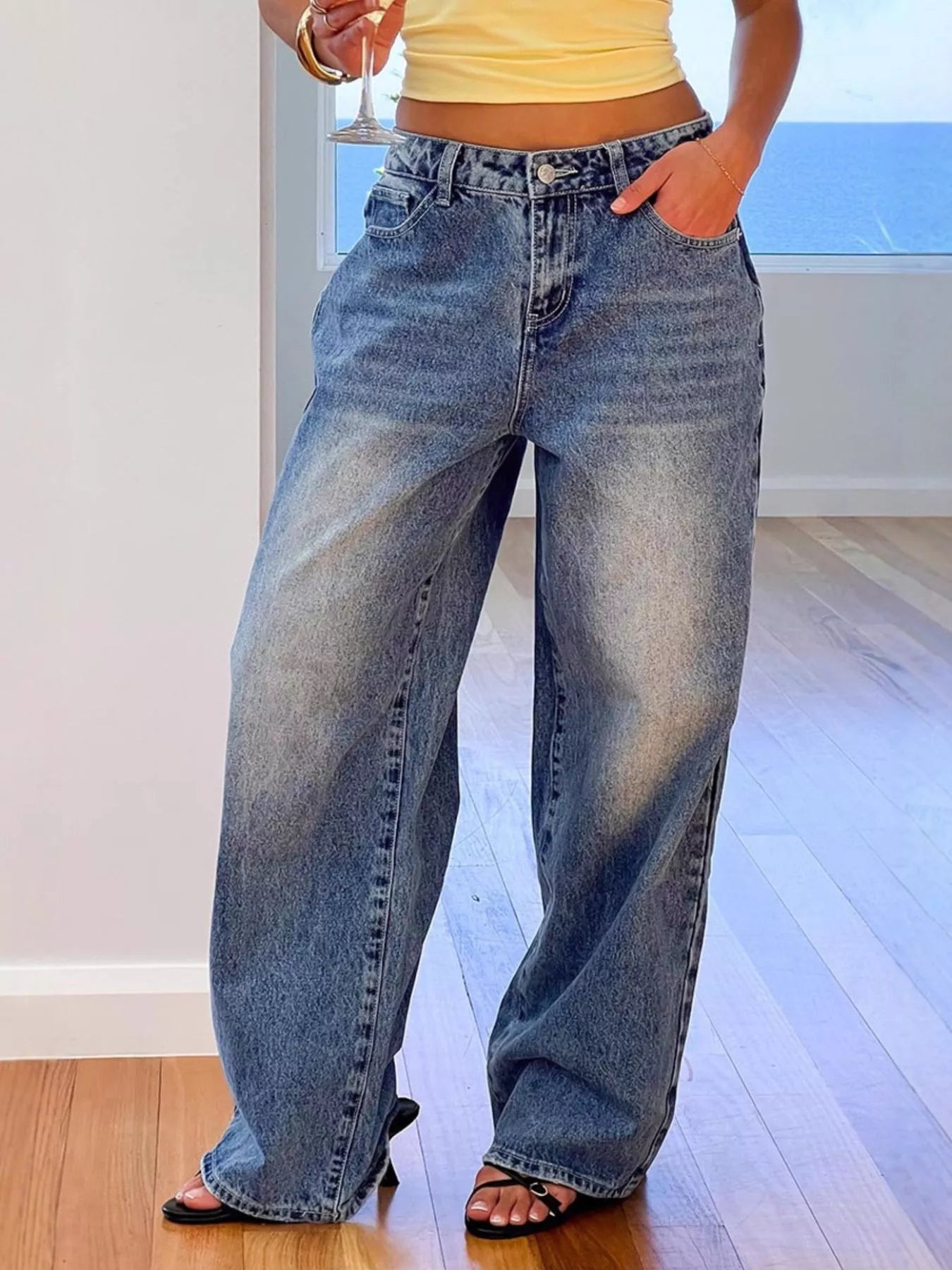 Blue pocketed wide leg jeans front view on model