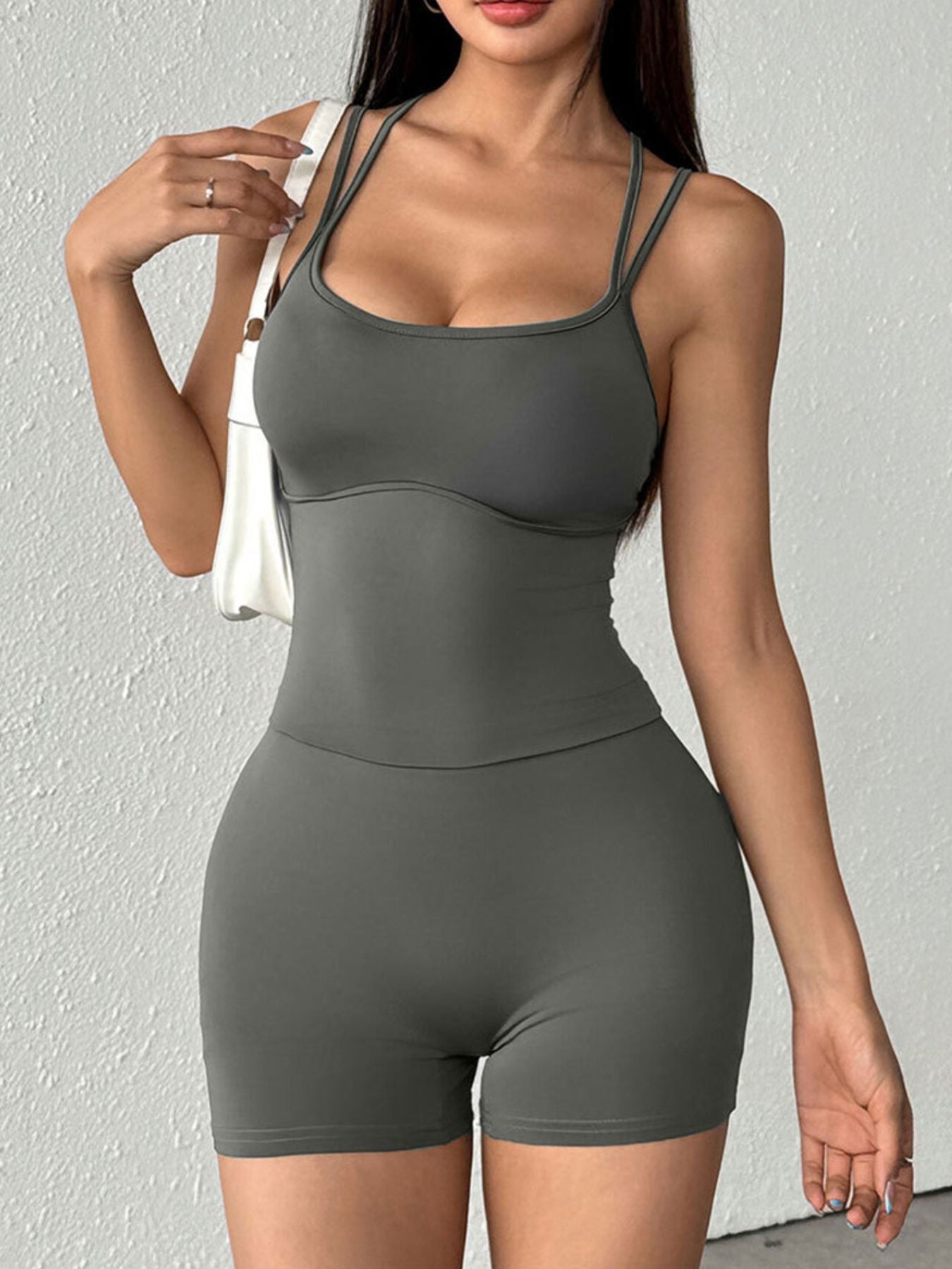 Spaghetti strap romper back view on model