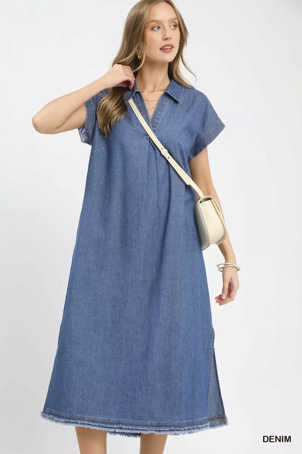 Denim midi dress close up of pocket and raw hem