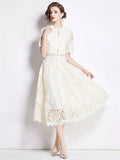 Woman wearing light apricot lace short sleeve midi dress front view