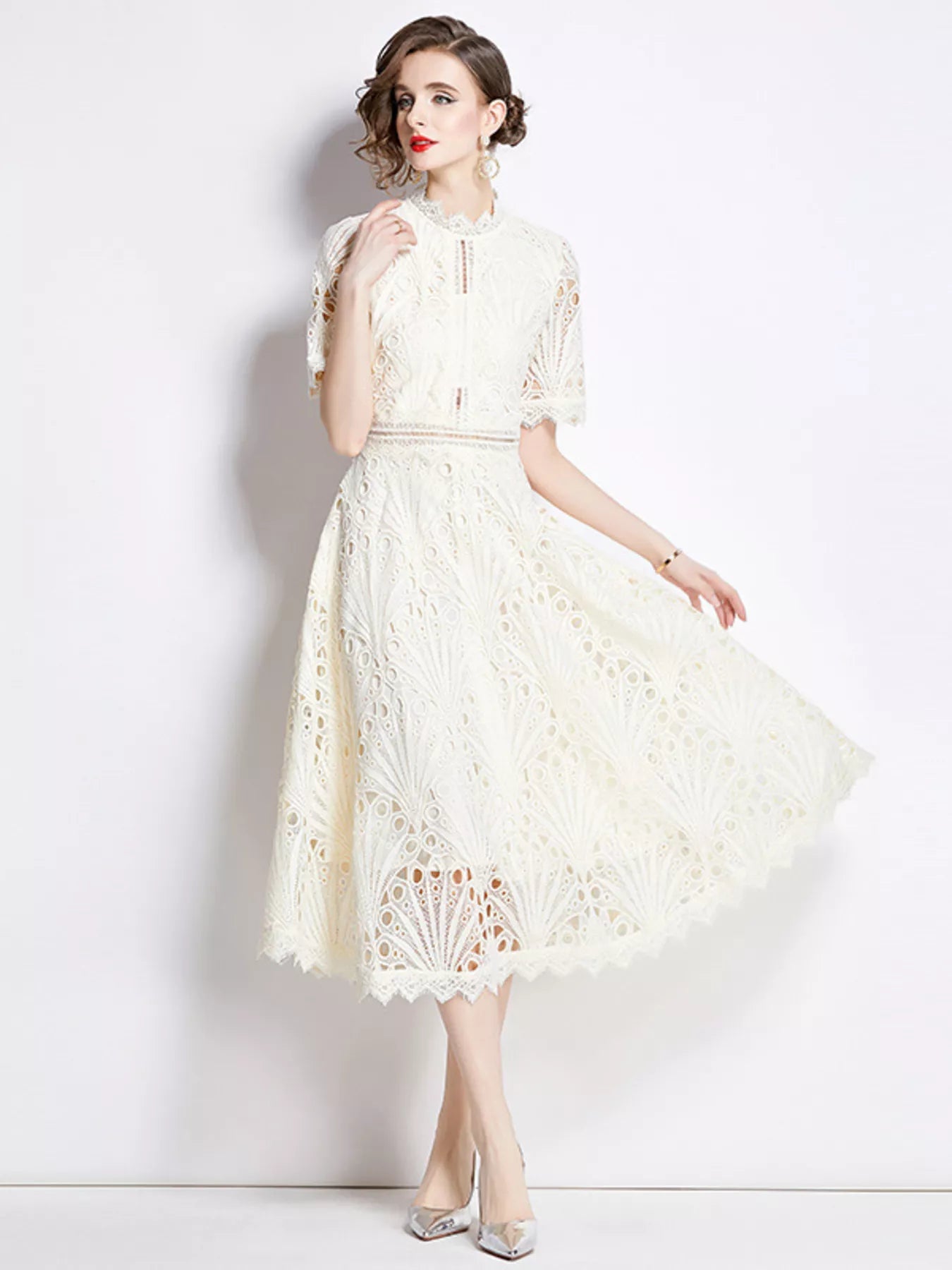 Woman wearing light apricot lace short sleeve midi dress front view
