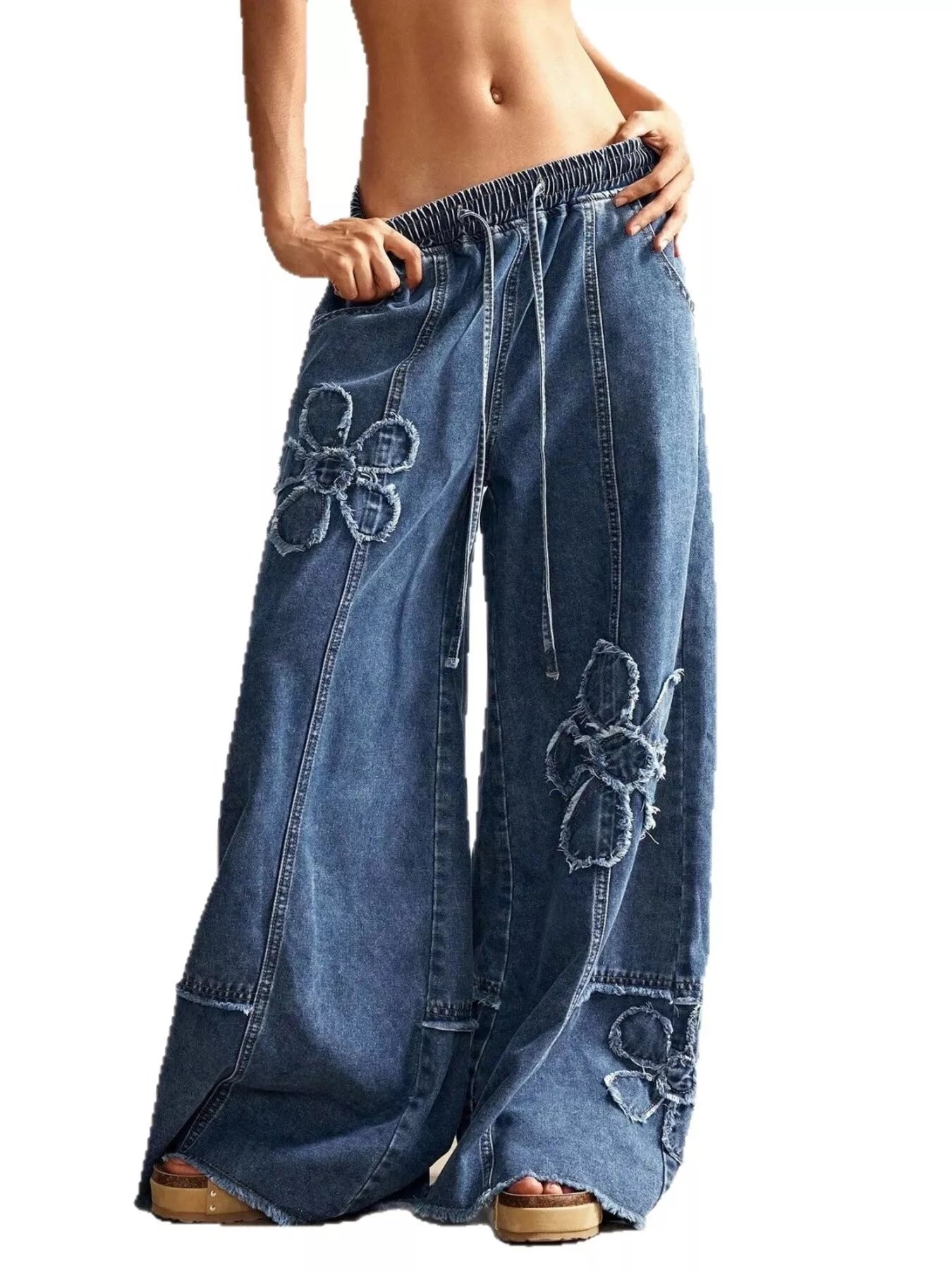 Close up of dimensional floral applique on denim