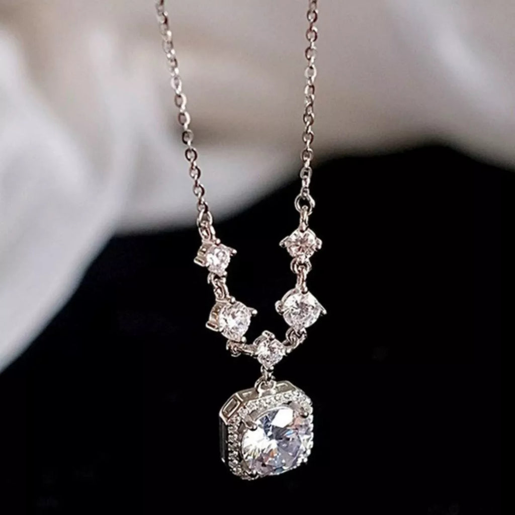 Moissanite necklace on model neckline
