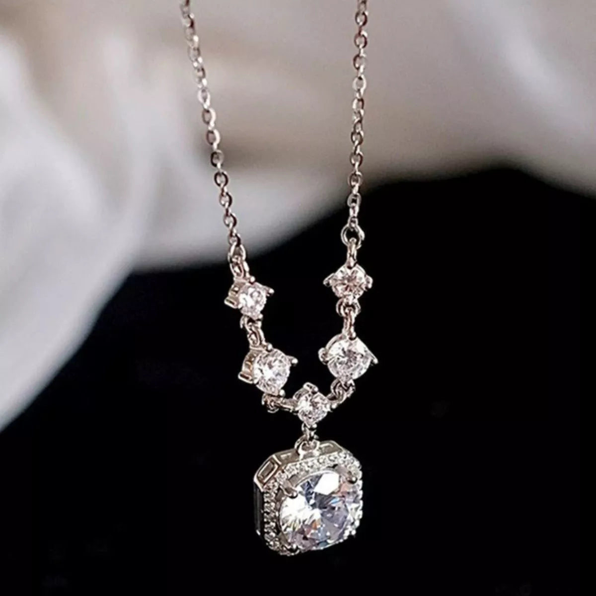 Moissanite necklace on model neckline