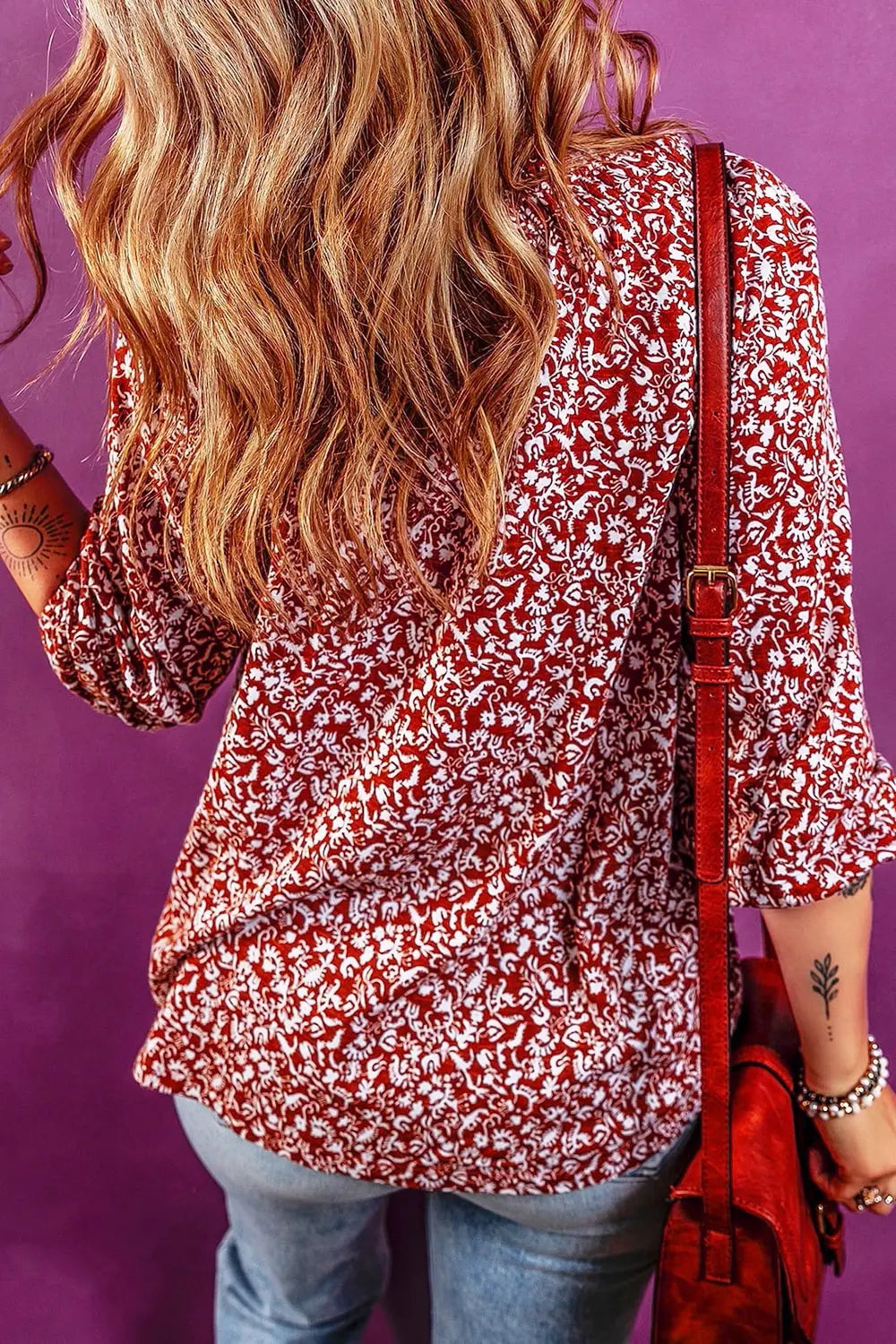 Tie neck detail on cerise printed blouse