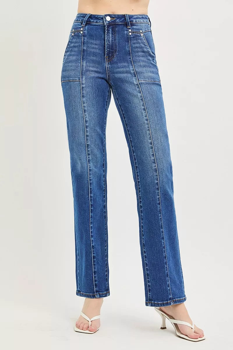 Woman wearing RISEN high rise straight jeans in dark wash