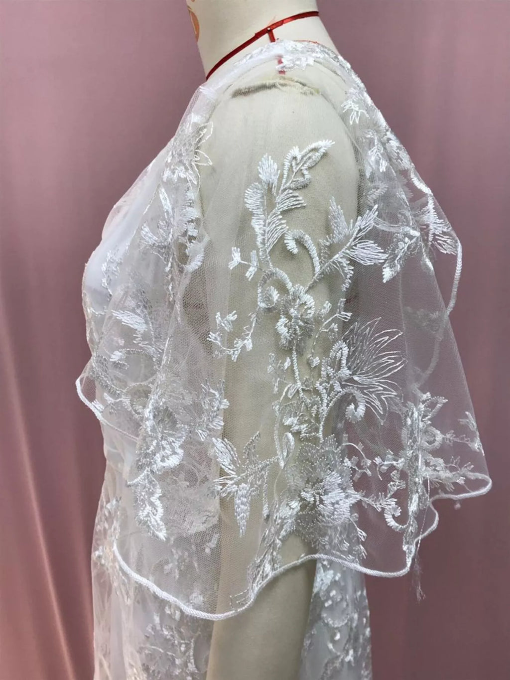 Sheer hem detail on white lace dress