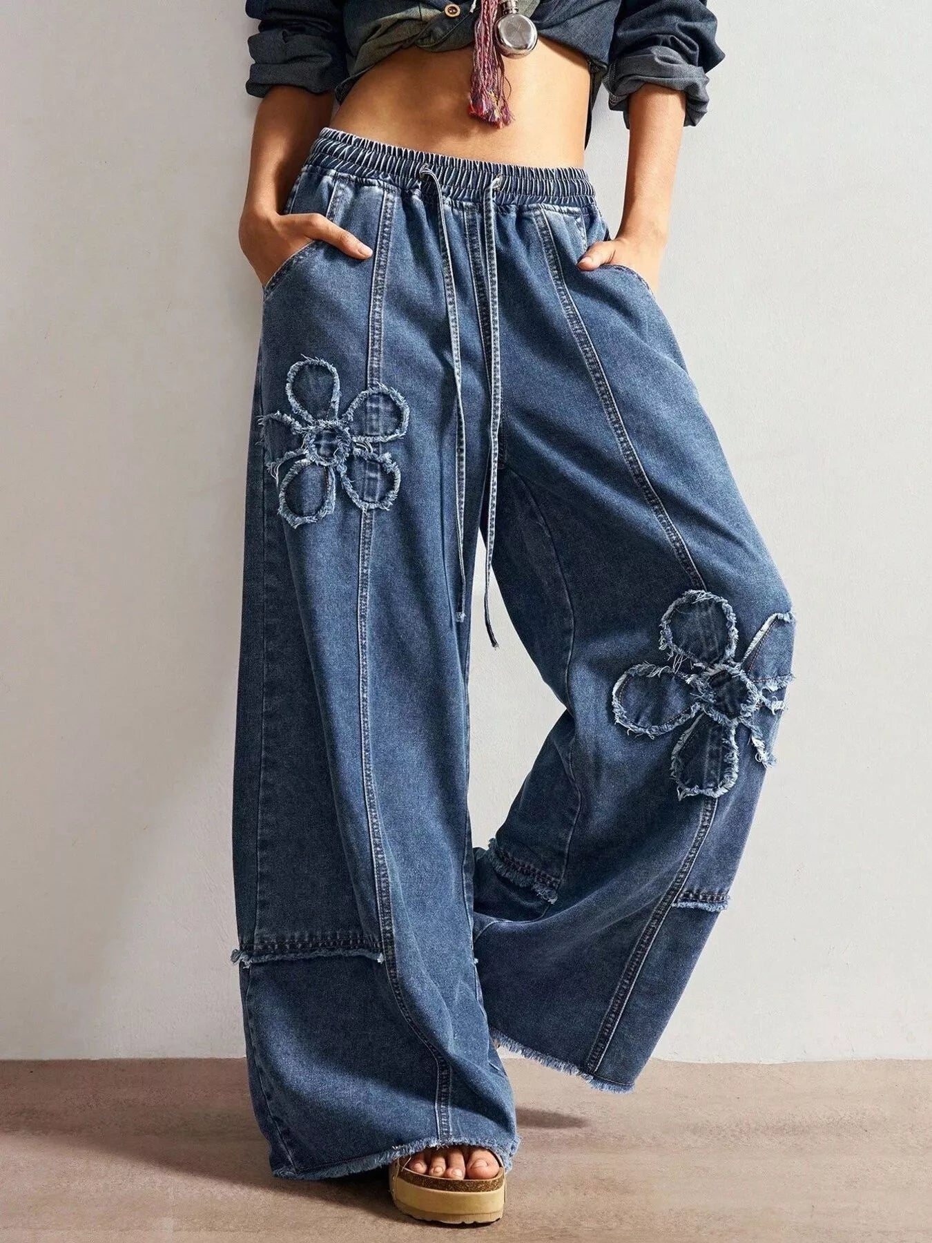 Floral applique jeans in black full view