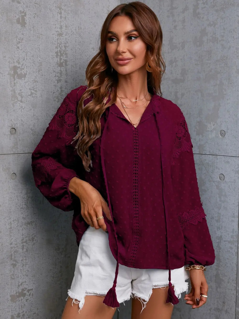 Crochet blouse tassel tie detail close up