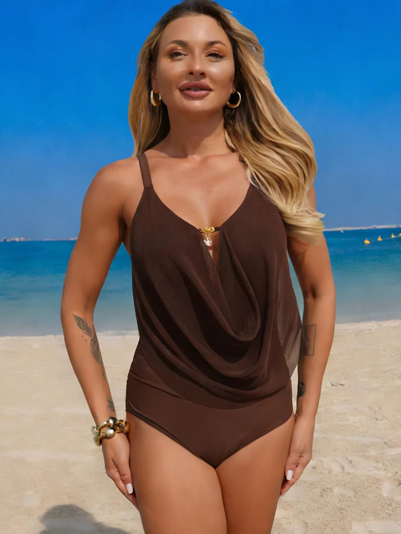 Model wearing ruched one piece swimsuit