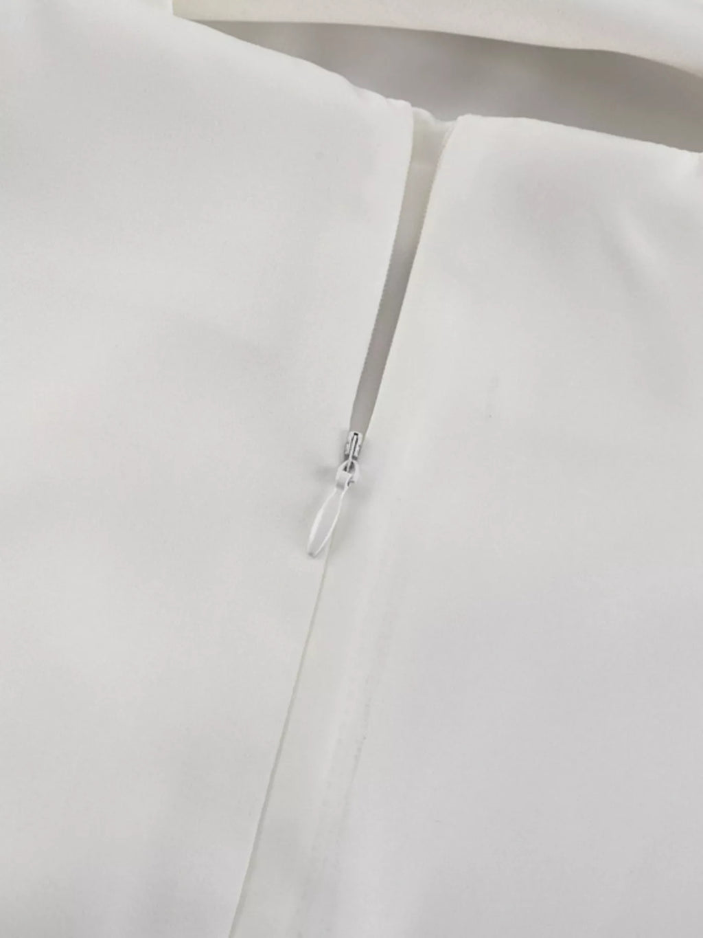 Halter neck dress close up of zipper closure