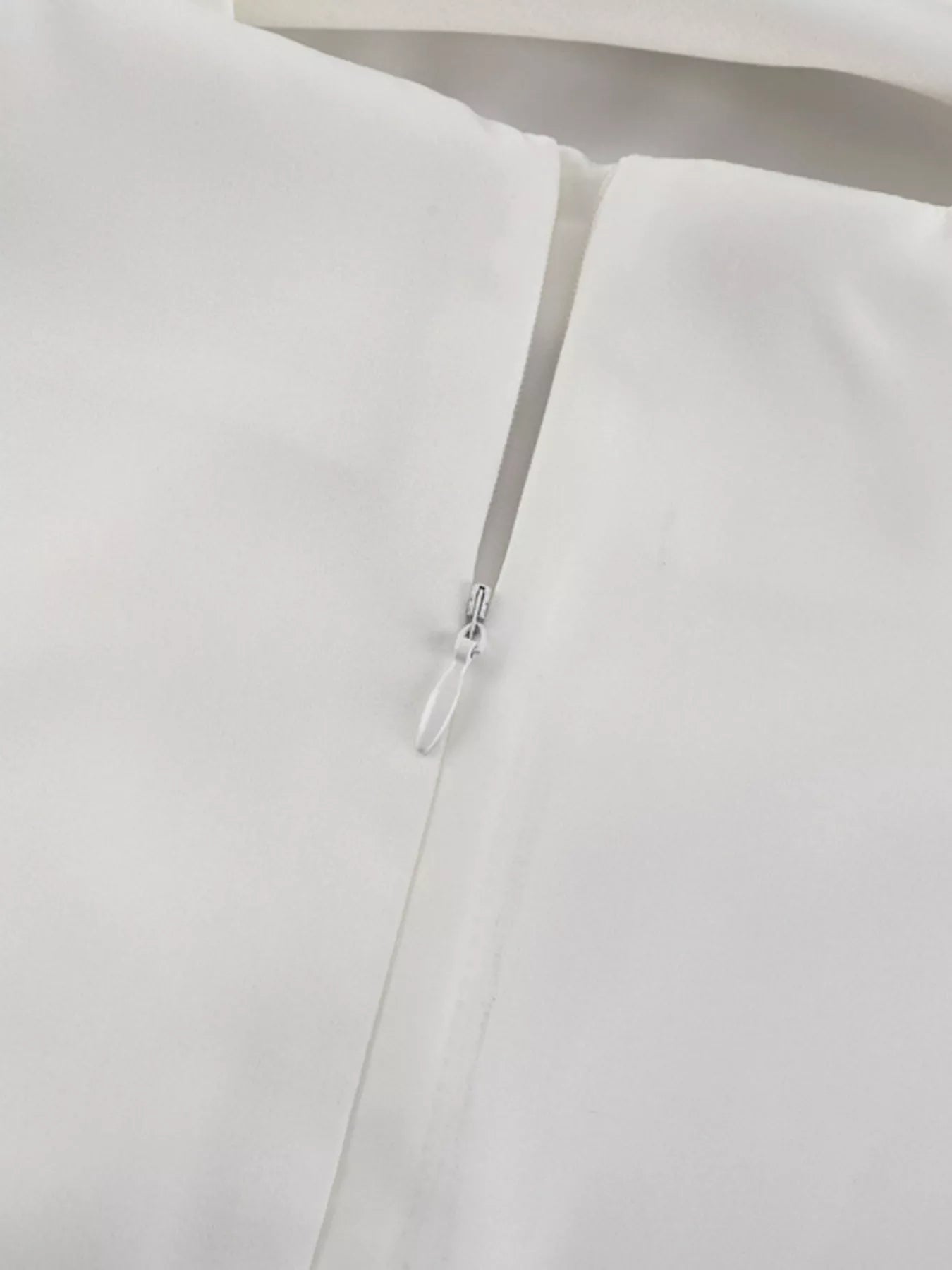 Halter neck dress close up of zipper closure