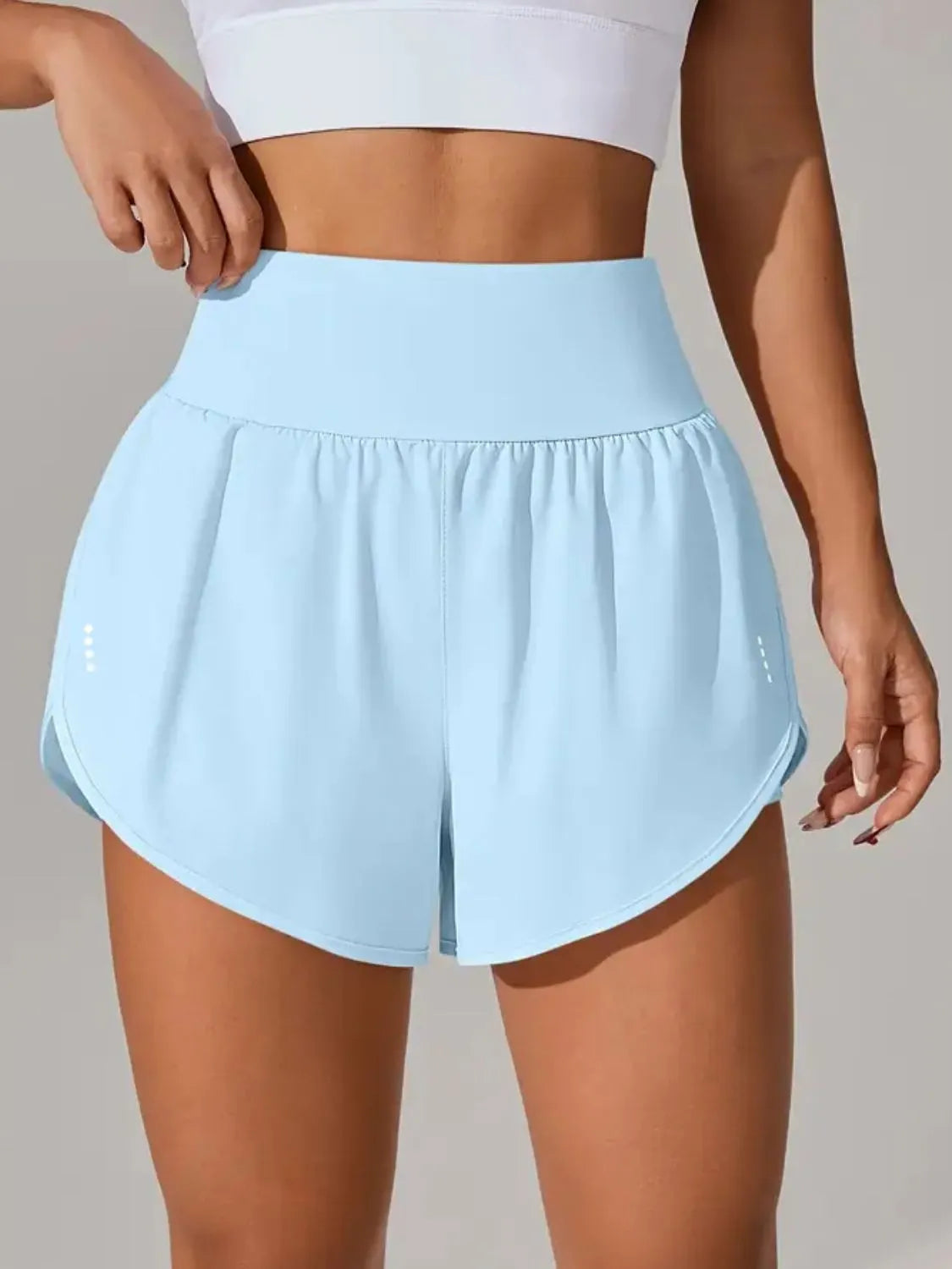 Orange active shorts side pocket detail view