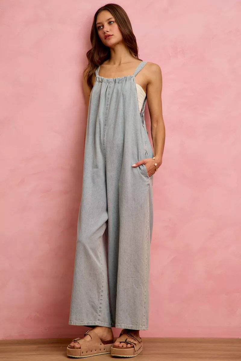 Lightweight denim overalls paired with sneakers