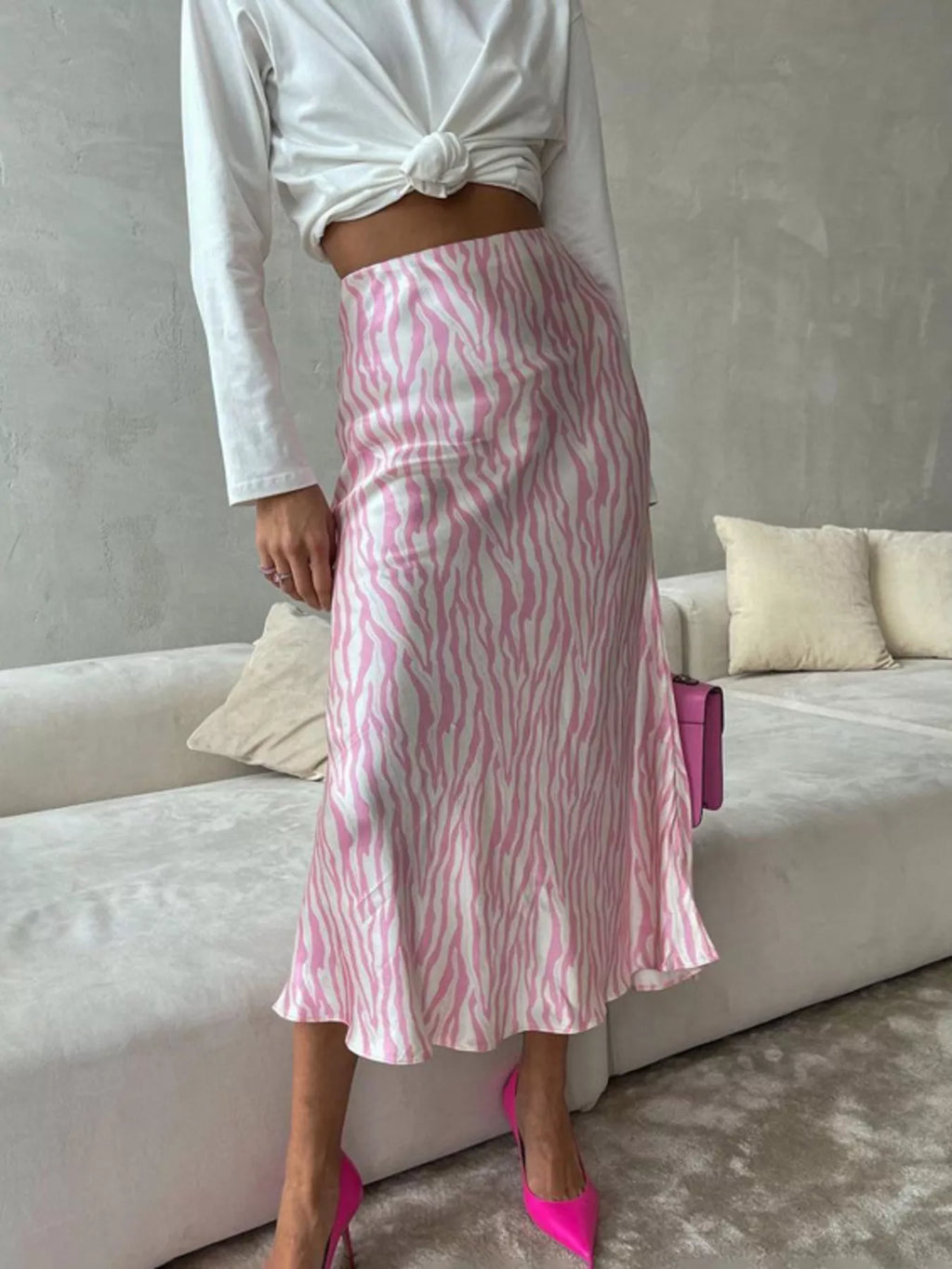 Model wearing satin zebra midi skirt