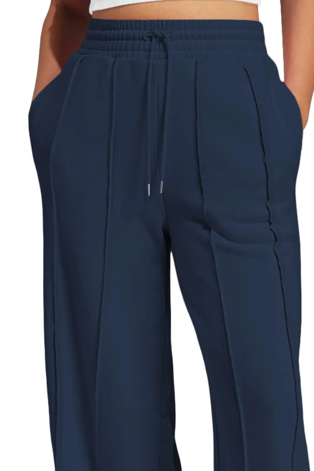 Detail of wide leg pant drape and hem